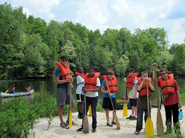 HiramHouseSchoolCamp2013PetersPondCanoeing_IMG_6407 Hiram House campers wearing lifejackets preparing to row in canoes