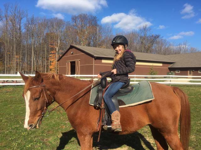 Hiram House Camp Horseback Riding Student riding horse at Hiram House Camp